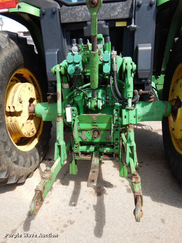 image for item DN8680 1999 John Deere 6310 MFWD tractor