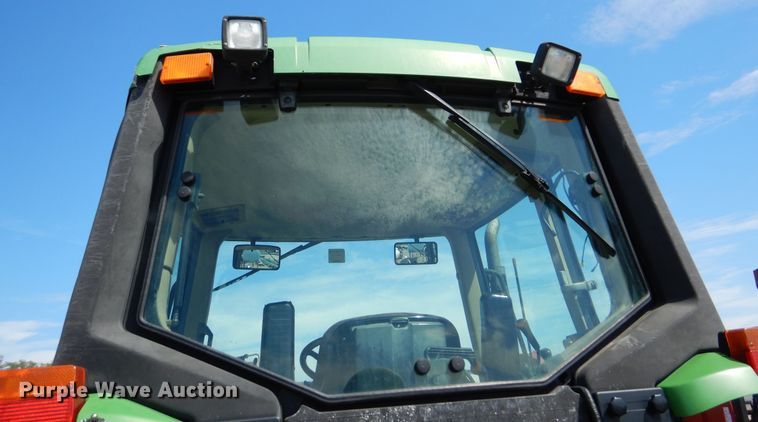 image for item DN8680 1999 John Deere 6310 MFWD tractor