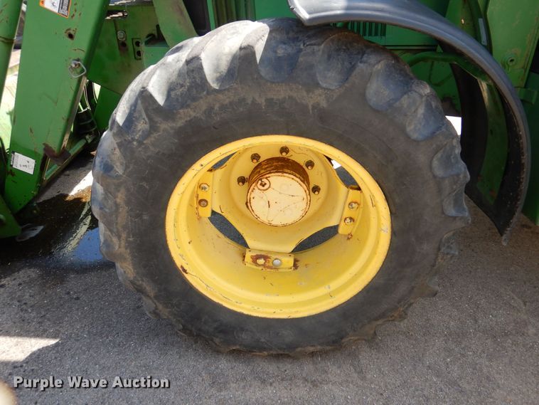 image for item DN8680 1999 John Deere 6310 MFWD tractor
