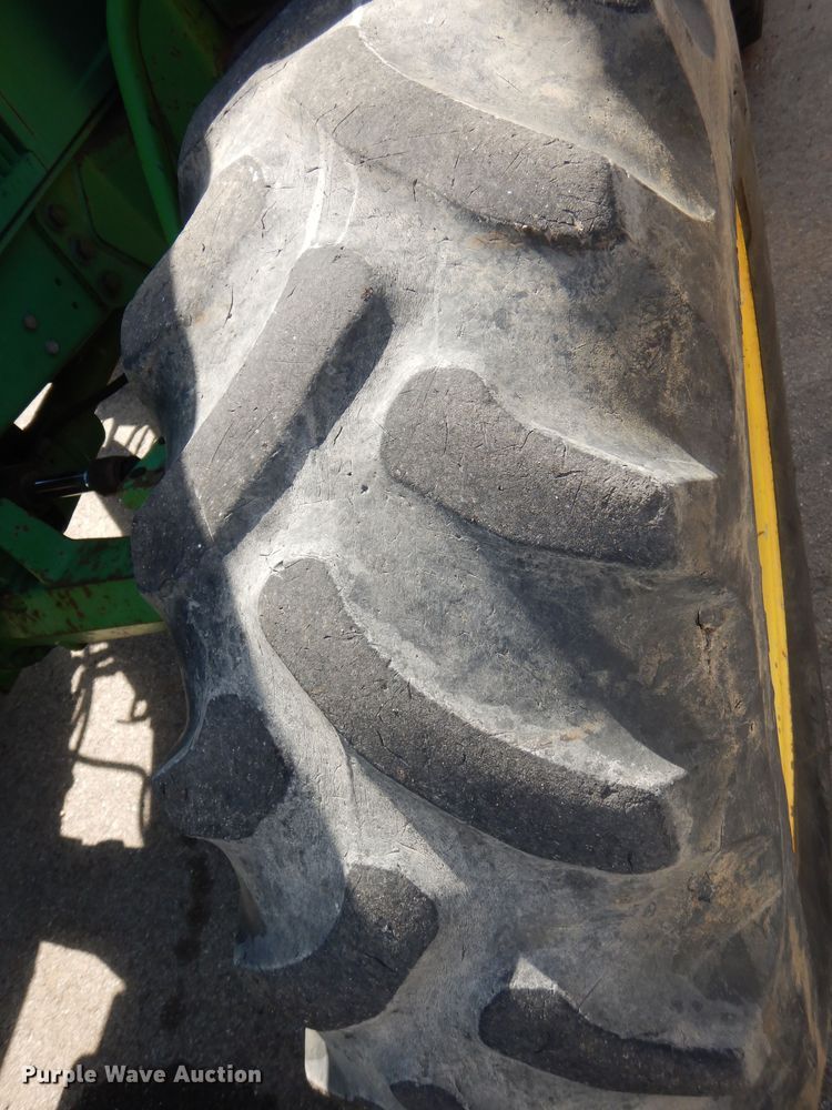 image for item DN8680 1999 John Deere 6310 MFWD tractor