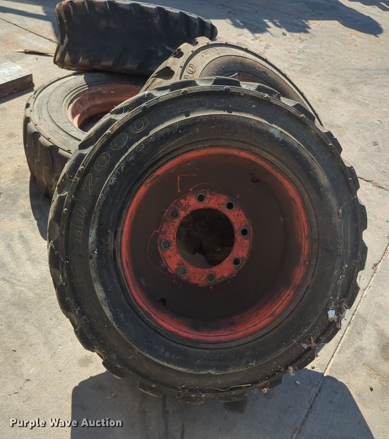 image for item KB9377 (4) 10-15.5NHS skid steer tires and wheels