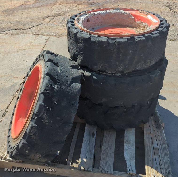 image for item KB9378 (4) 31x10-20 skid steer tires and wheels