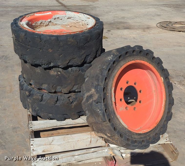 image for item KB9378 (4) 31x10-20 skid steer tires and wheels