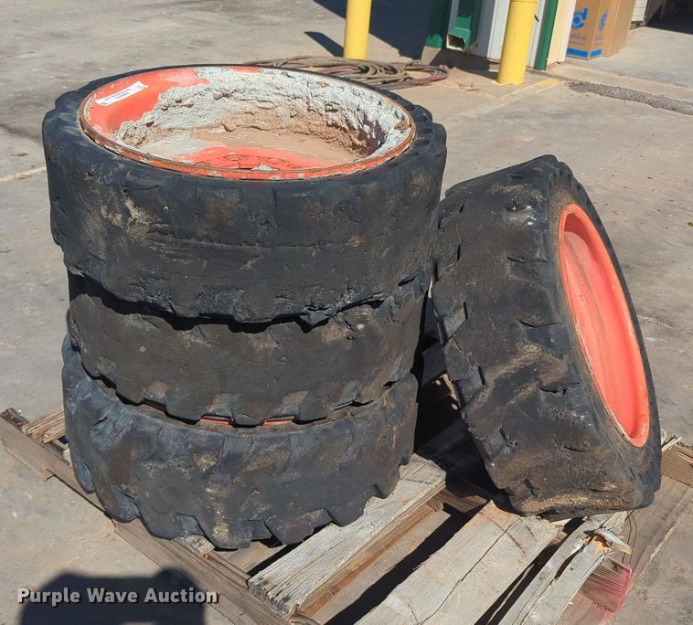 image for item KB9378 (4) 31x10-20 skid steer tires and wheels