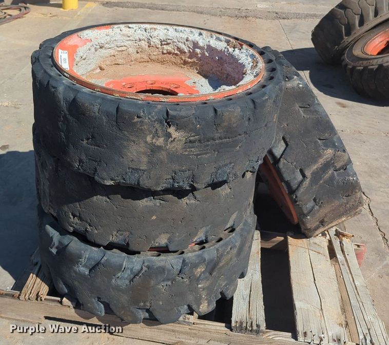 image for item KB9378 (4) 31x10-20 skid steer tires and wheels
