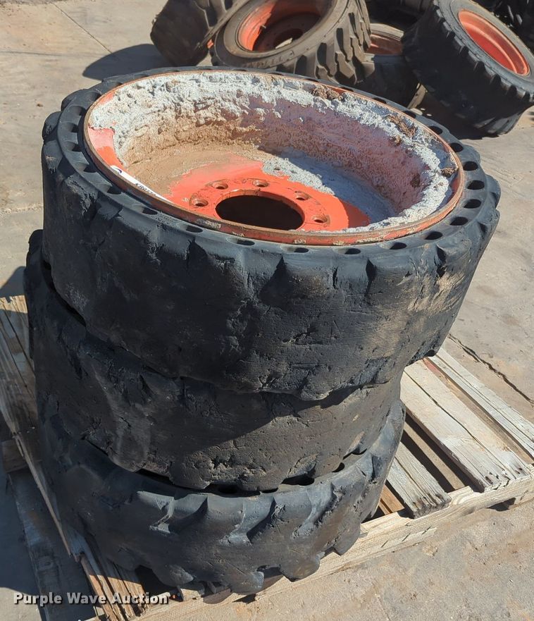 image for item KB9378 (4) 31x10-20 skid steer tires and wheels
