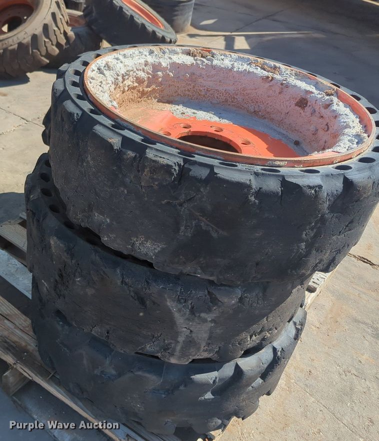 image for item KB9378 (4) 31x10-20 skid steer tires and wheels