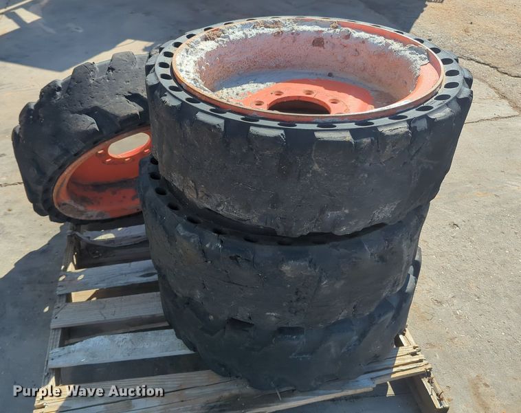 image for item KB9378 (4) 31x10-20 skid steer tires and wheels