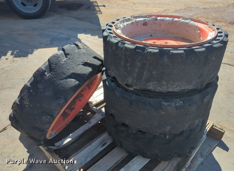 image for item KB9378 (4) 31x10-20 skid steer tires and wheels