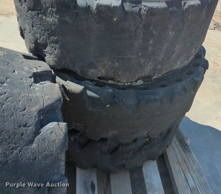 image for item KB9378 (4) 31x10-20 skid steer tires and wheels
