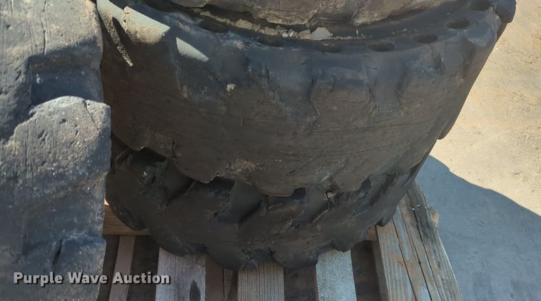 image for item KB9378 (4) 31x10-20 skid steer tires and wheels