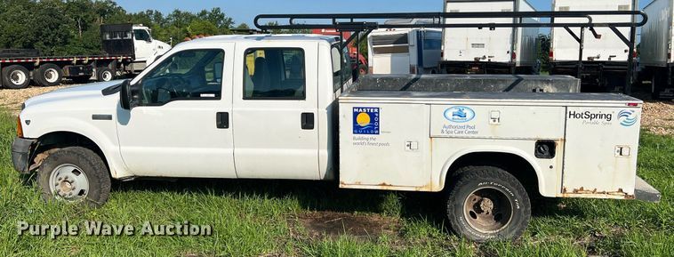 image for item NA9086 2005 Ford F350 Super Duty XL  Crew Cab utility bed pickup truck