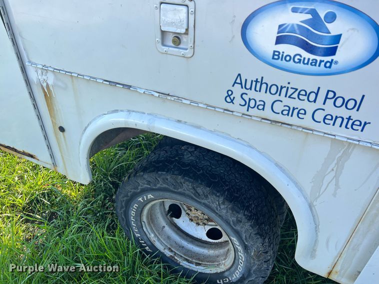 image for item NA9086 2005 Ford F350 Super Duty XL  Crew Cab utility bed pickup truck