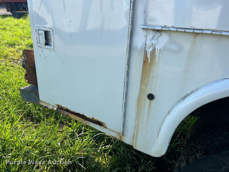 image for item NA9086 2005 Ford F350 Super Duty XL  Crew Cab utility bed pickup truck