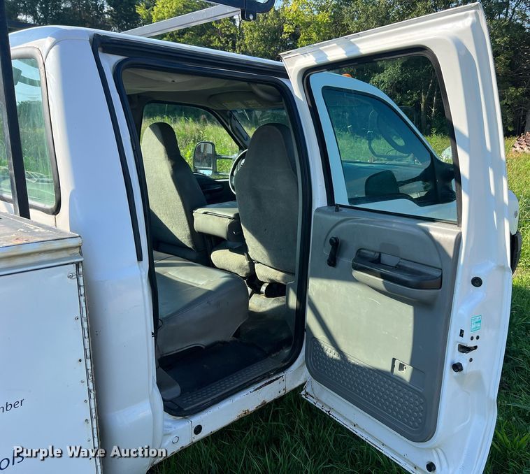 image for item NA9086 2005 Ford F350 Super Duty XL  Crew Cab utility bed pickup truck