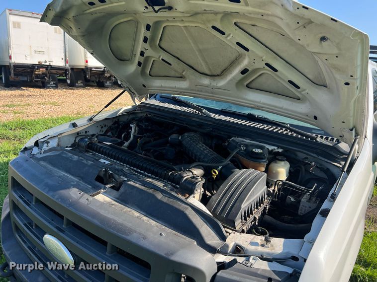 image for item NA9086 2005 Ford F350 Super Duty XL  Crew Cab utility bed pickup truck