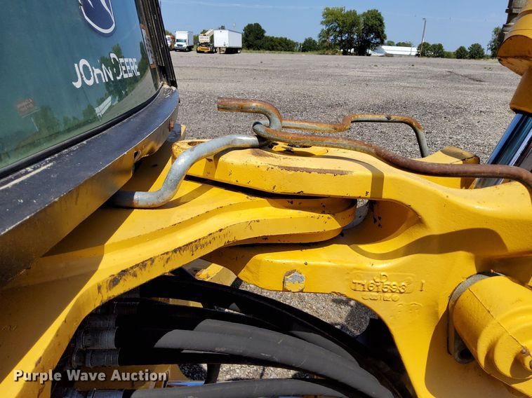 image for item KW9023 2004 John Deere 310SG  backhoe