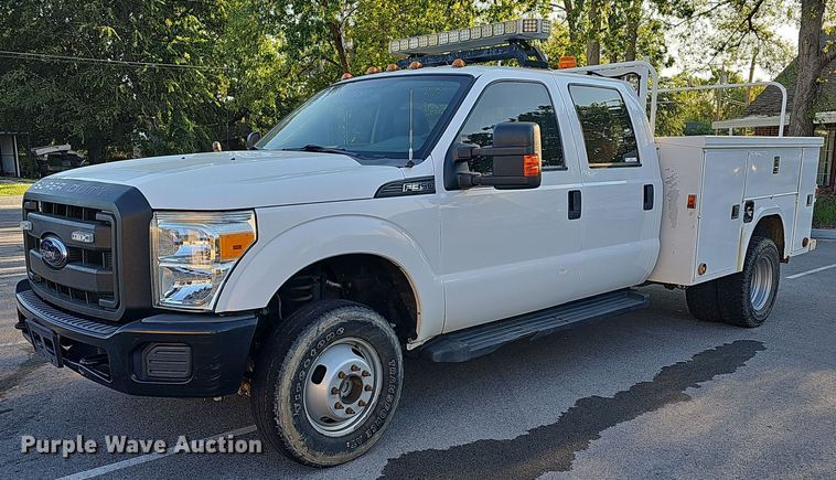 image for item LE9727 2014 Ford F350  Crew Cab utility bed pickup truck