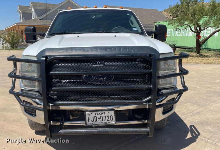 image for item KM9812 2015 Ford F350 Super Duty  Crew Cab flatbed pickup truck