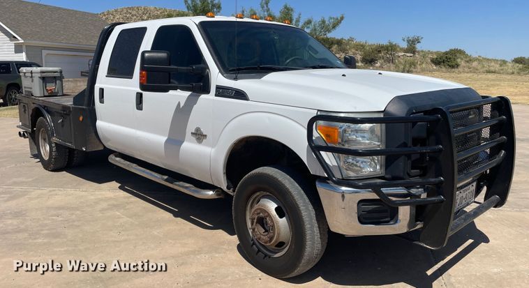 image for item KM9812 2015 Ford F350 Super Duty  Crew Cab flatbed pickup truck