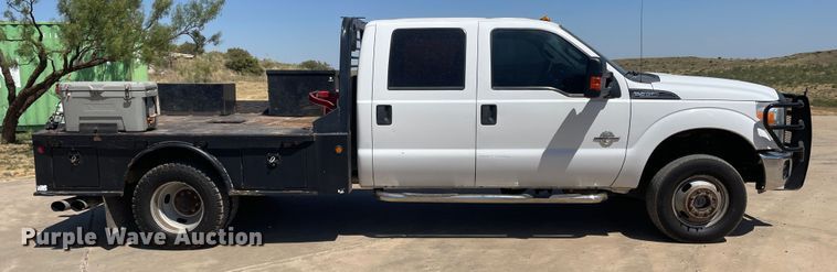 image for item KM9812 2015 Ford F350 Super Duty  Crew Cab flatbed pickup truck