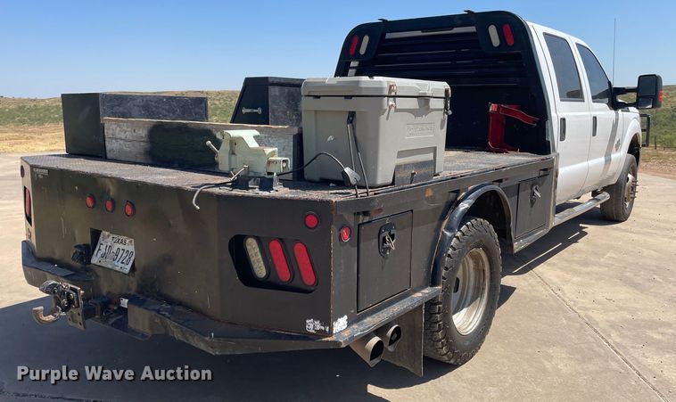 image for item KM9812 2015 Ford F350 Super Duty  Crew Cab flatbed pickup truck