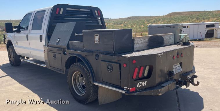 image for item KM9812 2015 Ford F350 Super Duty  Crew Cab flatbed pickup truck
