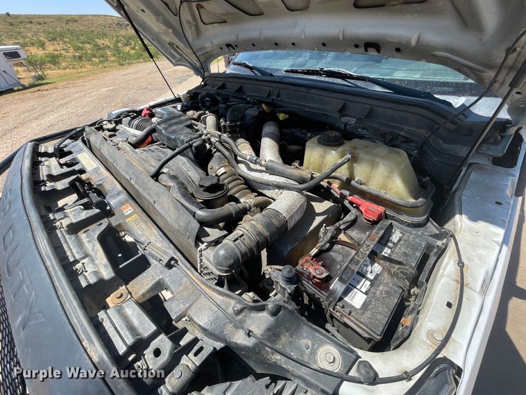 image for item KM9812 2015 Ford F350 Super Duty  Crew Cab flatbed pickup truck