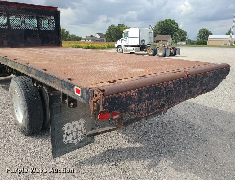 image for item MJ9387 1993 Freightliner FL70  dump flatbed truck