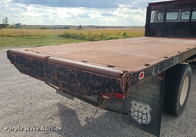 image for item MJ9387 1993 Freightliner FL70  dump flatbed truck