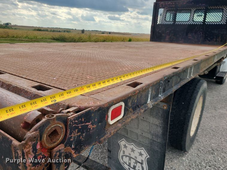 image for item MJ9387 1993 Freightliner FL70  dump flatbed truck