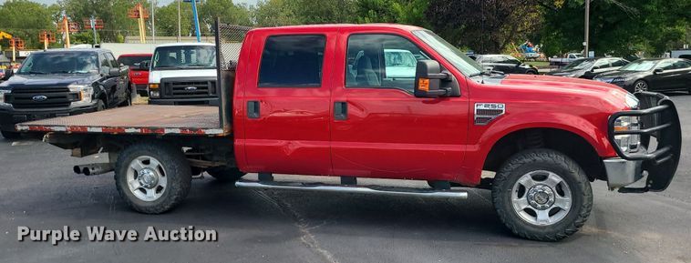image for item MJ9410 2010 Ford F250 Super Duty  Crew Cab flatbed pickup truck