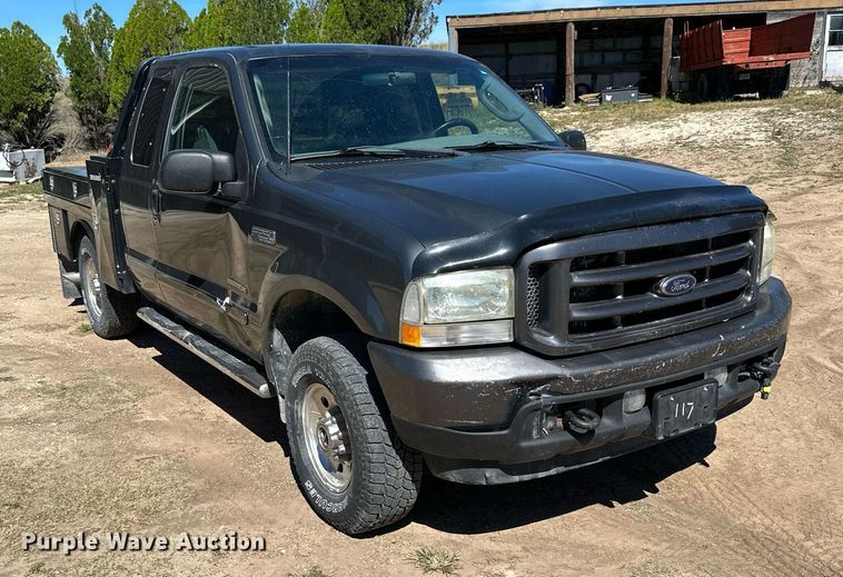 image for item NP9643 2003 Ford F250 Super Duty XLT  SuperCab flatbed pickup truck