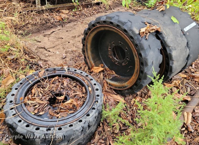 image for item JE9507 (4) 31 x 10-20 solid skid steer wheels and tires