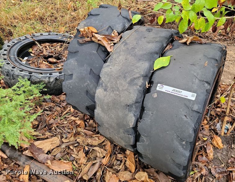 image for item JE9507 (4) 31 x 10-20 solid skid steer wheels and tires