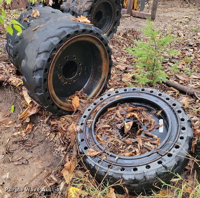 image for item JE9507 (4) 31 x 10-20 solid skid steer wheels and tires