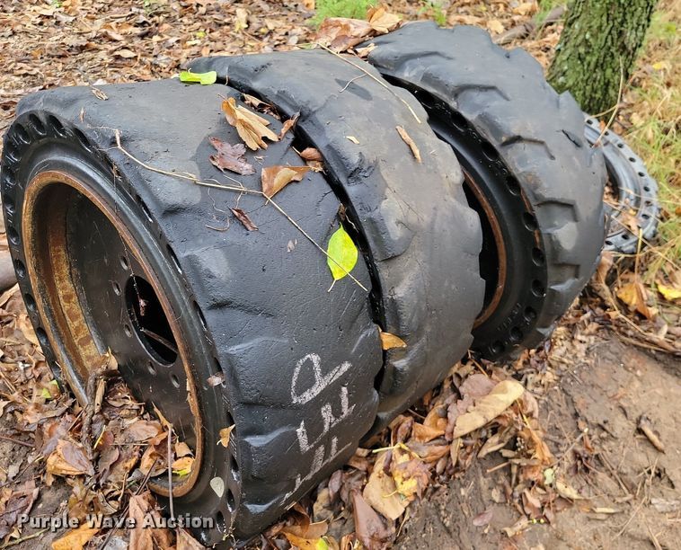 image for item JE9507 (4) 31 x 10-20 solid skid steer wheels and tires