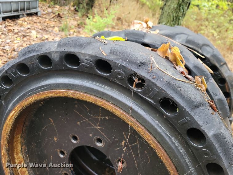 image for item JE9507 (4) 31 x 10-20 solid skid steer wheels and tires