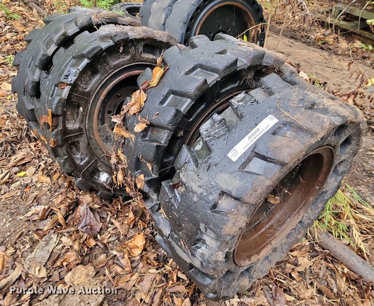 image for item JE9508 (4) 31 x 10-20 solid skid steer tires and wheels