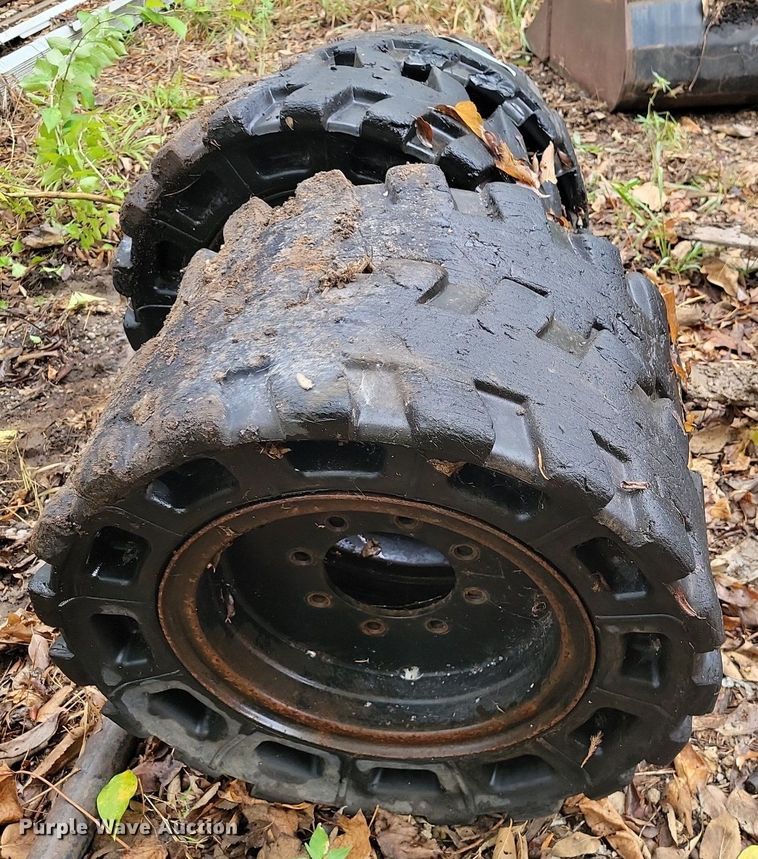 image for item JE9508 (4) 31 x 10-20 solid skid steer tires and wheels