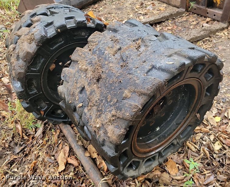 image for item JE9508 (4) 31 x 10-20 solid skid steer tires and wheels