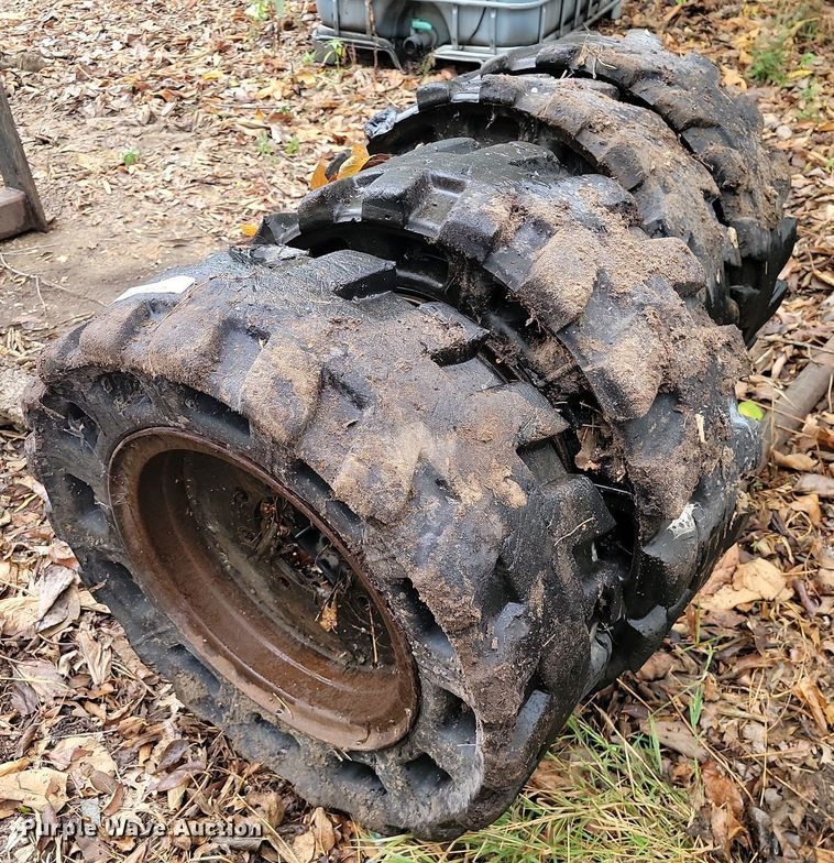 image for item JE9508 (4) 31 x 10-20 solid skid steer tires and wheels