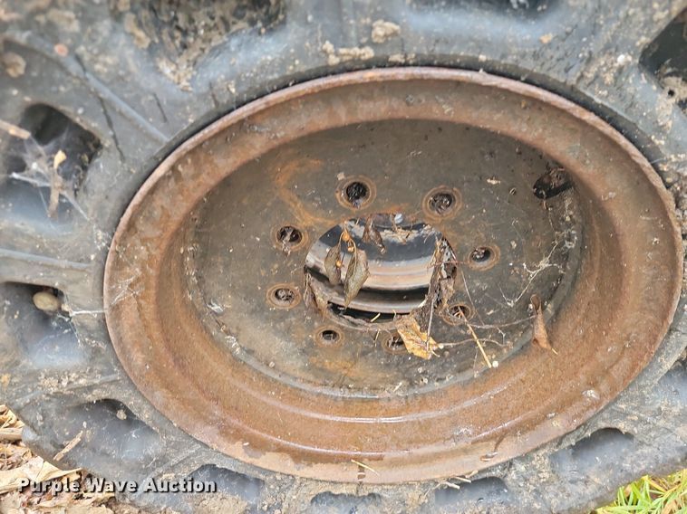 image for item JE9508 (4) 31 x 10-20 solid skid steer tires and wheels
