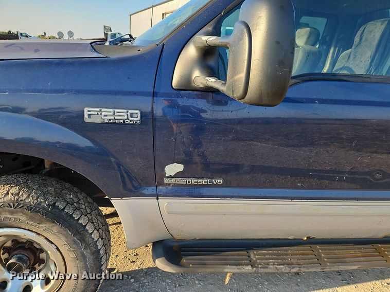 image for item LM9151 2002 Ford F250 Super Duty  SuperCab flatbed pickup truck