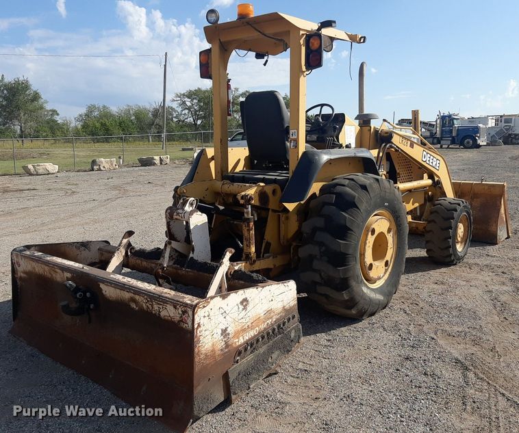 image for item OF9460 2001 John Deere 210LE  landscape tractor