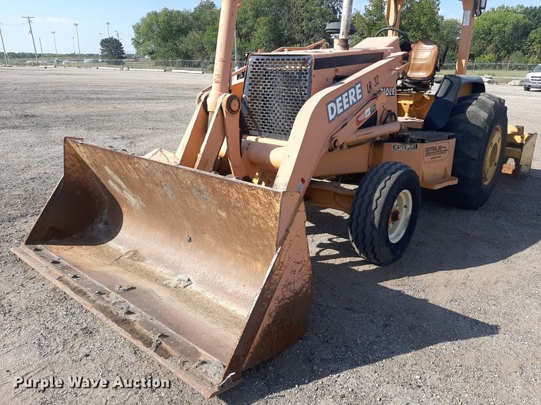 image for item OF9461 2000 John Deere 210LE  landscape tractor