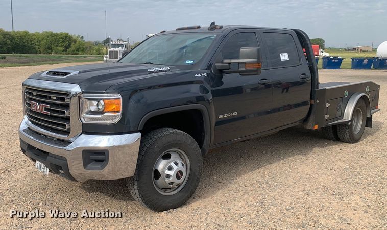 image for item DP8670 2018 GMC Sierra 3500HD  Crew Cab flatbed pickup truck