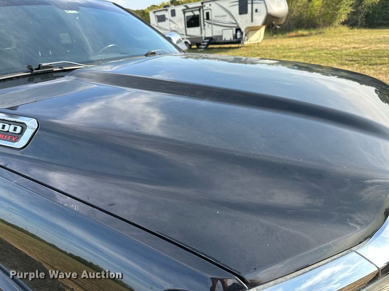 image for item NQ9365 2019 Dodge  Ram 3500 Laramie Crew Cab flatbed pickup truck