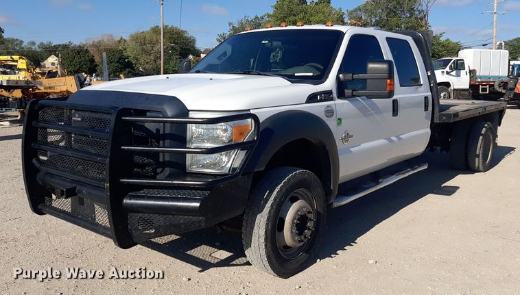 image for item OF9526 2014 Ford F550 Super Duty  Crew Cab flatbed truck