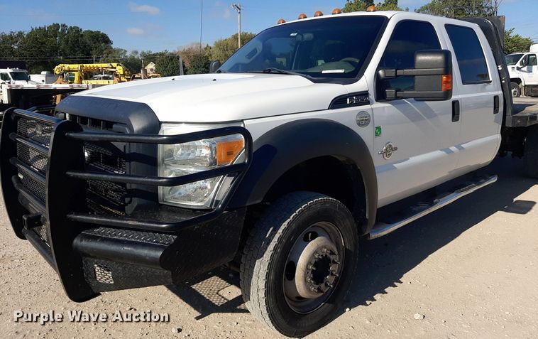 image for item OF9526 2014 Ford F550 Super Duty  Crew Cab flatbed truck